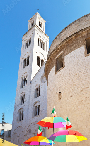  Italy. Bari. The bell tower of the Cathedral of St. Sabino and souvenir umbrellas with Italian flags