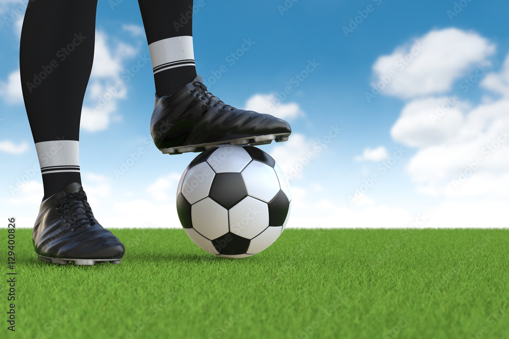 soccer player standing with soccer ball