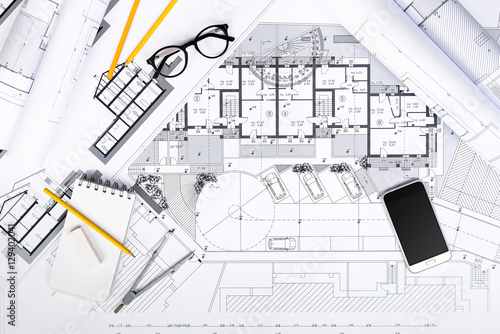 Construction plans with drawing Tools and Smart Phone on bluepri