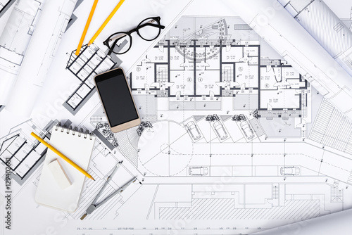 Construction plans with drawing Tools and Smart Phone on bluepri