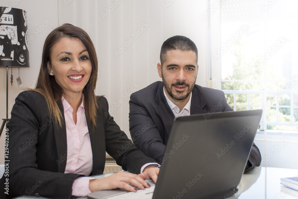 Business people working in group in the office.Young business people working on lap top. Business and office concept. Business people working in group in the office.Young business people working on lap top. Business and office concept.