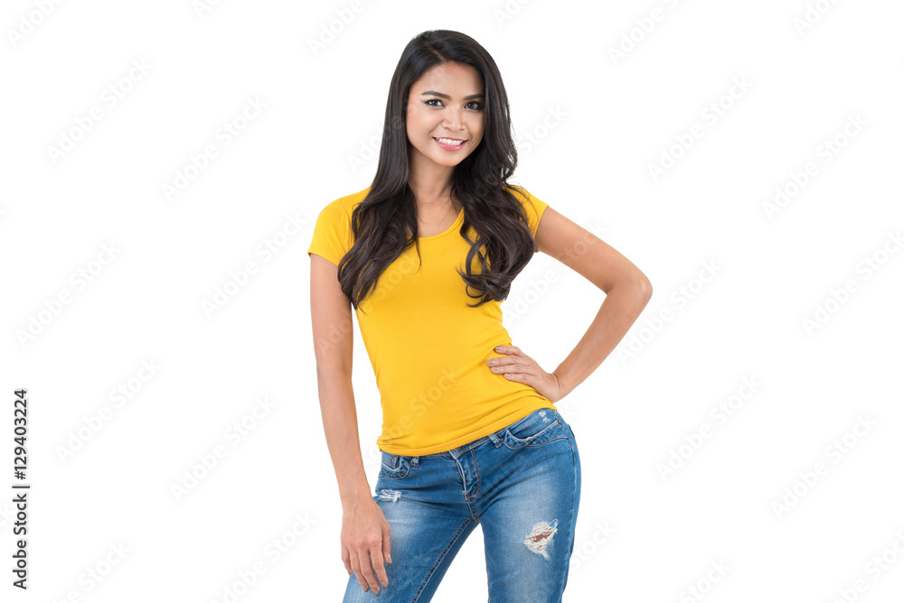 Asian woman in plain yellow t-shirt and blue jeans Stock Photo | Adobe Stock