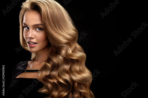 Beautiful Curly Hair. Female Beauty Model With Volume Hair