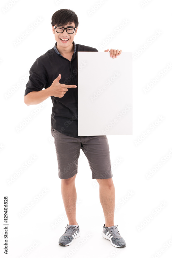 Male student holding a white board against white background. Asi Male student holding a white board against white background. Asi