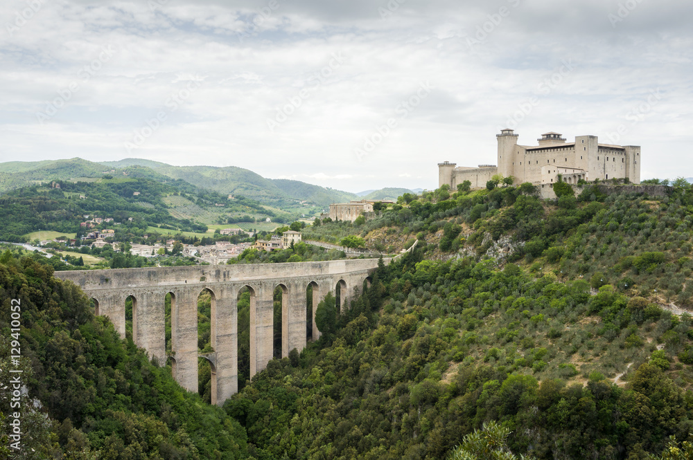The old bridge aqueduct Ponte delle Torri and the medieval fortress Rocca Albornoziana. Spoleto, Umbria, Italy.