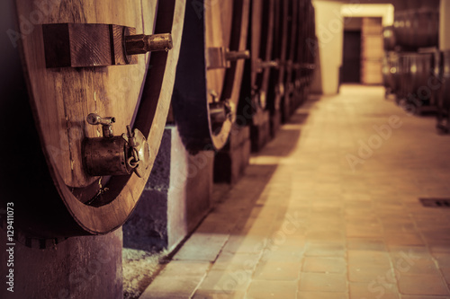 Wine oak barrell in cellar photo