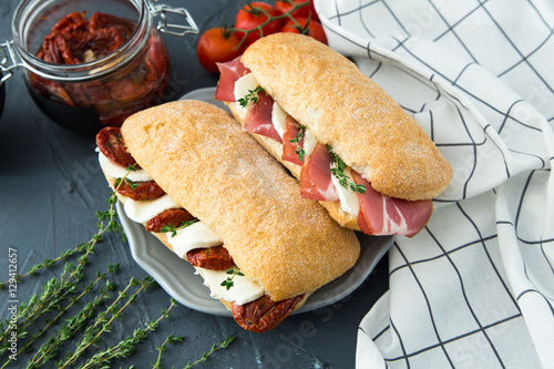 assorted sandwiches. sandwich Caprese with mozzarella and sun-dr