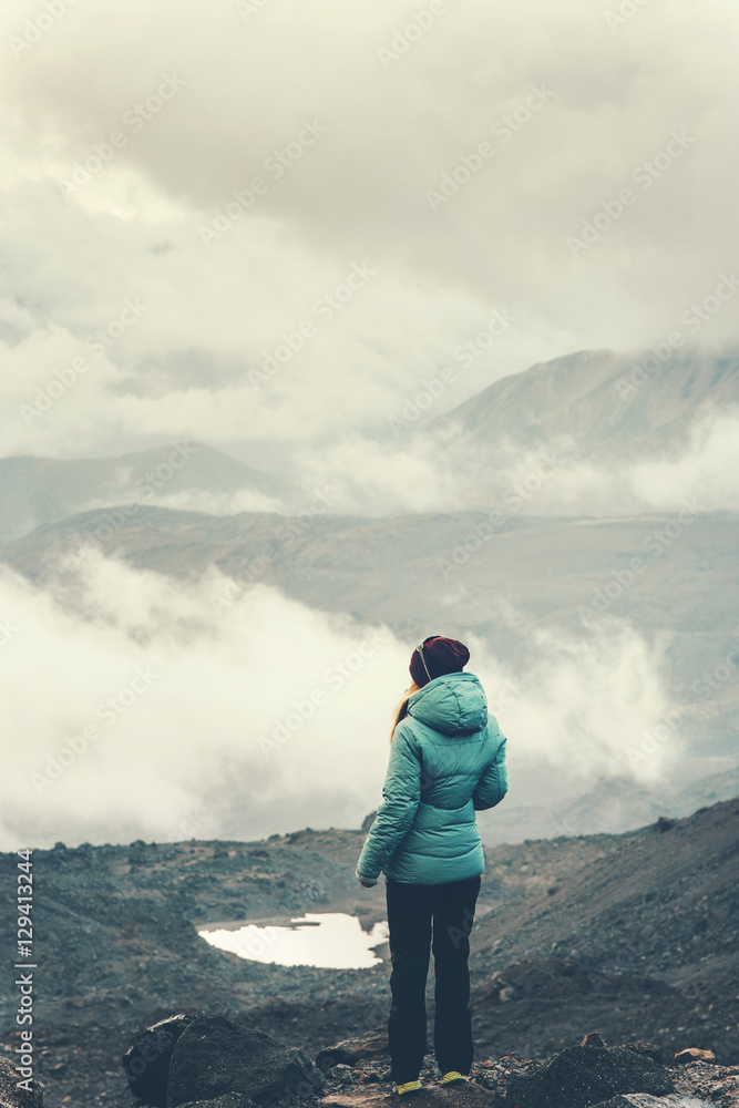 Woman Traveler mountaineering cloudy foggy mountains landscape Travel Lifestyle concept adventure vacations outdoor