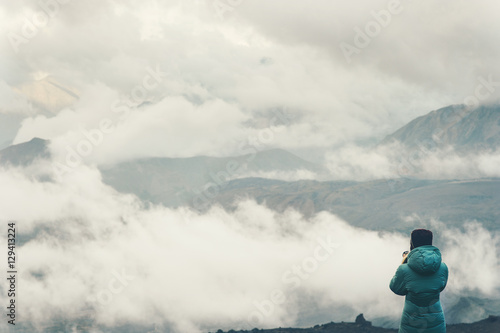 Traveler climbing enjoying cloudy foggy mountains landscape Travel Lifestyle concept adventure vacations outdoor