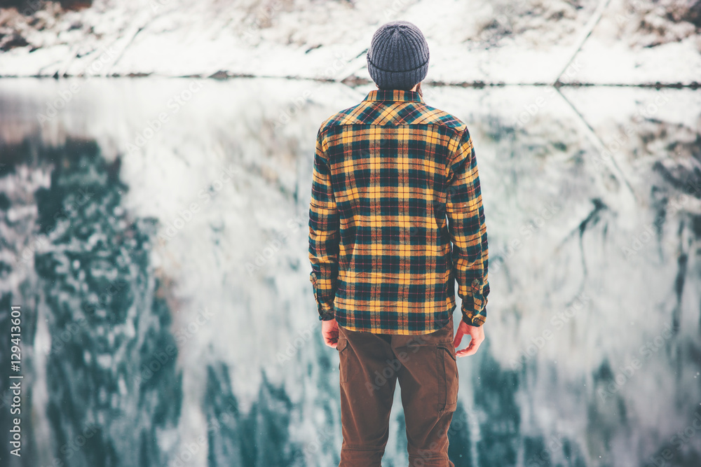 Man Traveling enjoy lake and forest winter landscape Travel Lifestyle concept adventure vacations hiking outdoor Man Traveling enjoy lake and forest winter landscape Travel Lifestyle concept adventure vacations hiking outdoor