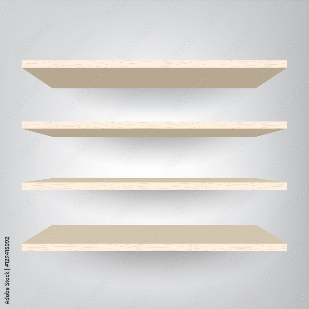 Empty wood shelves on light gray wall Empty wood shelves on light gray wall