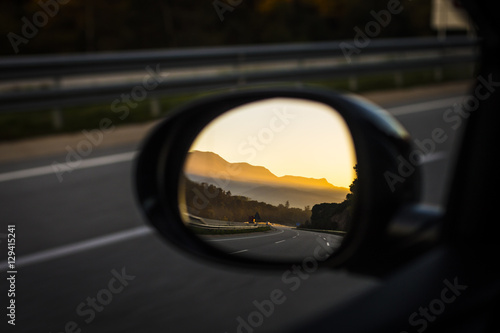 Sunset shining on a mirror car © jordieasy