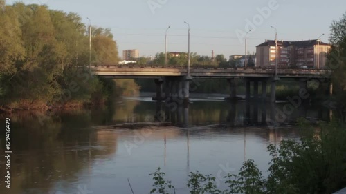 Bridge over the river in the city at dawn