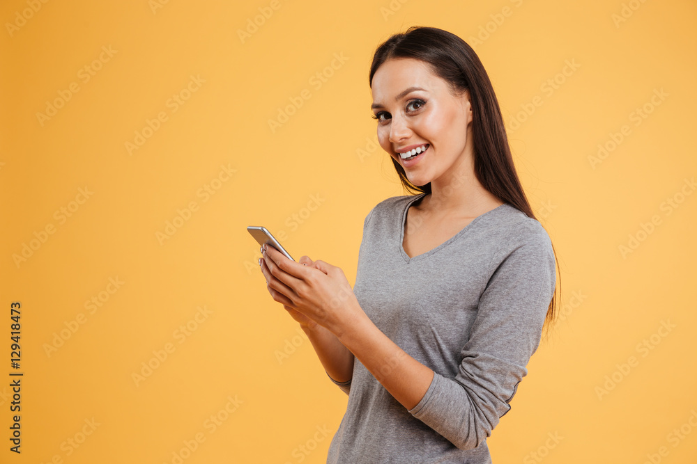 Side view of smiling girl with phone Side view of smiling girl with phone