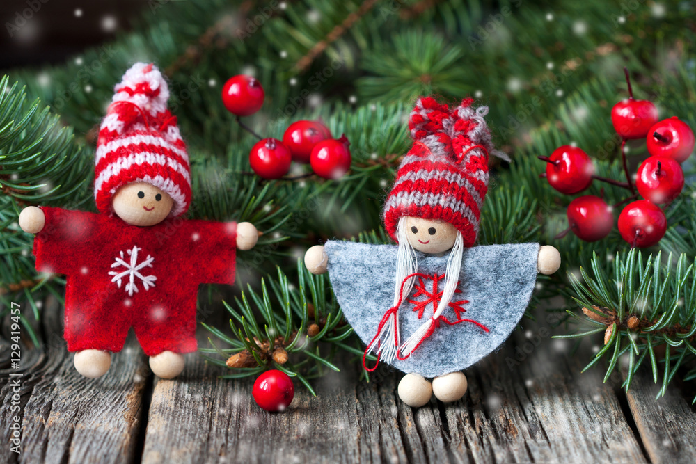 Small children christmas figures on wooden background Small children christmas figures on wooden background