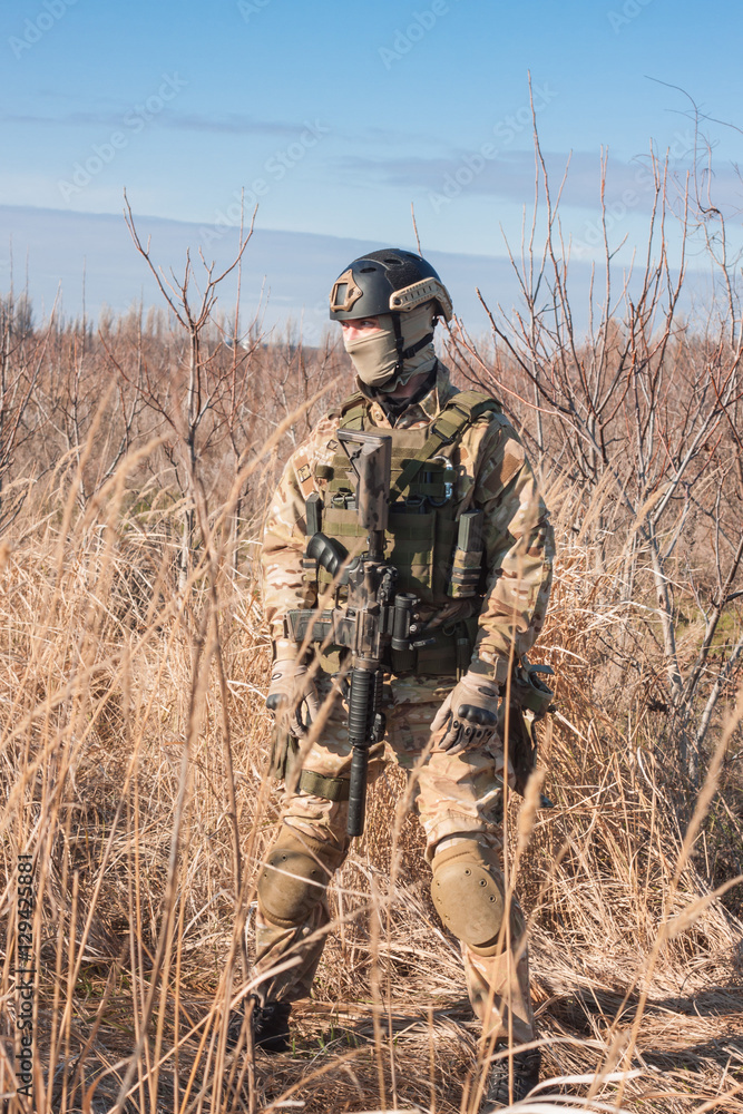 airsoft soldier with a rifle and full amunition airsoft soldier with a rifle and full amunition