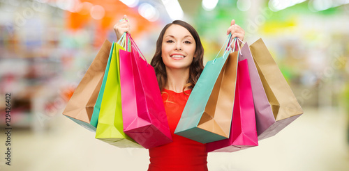 woman with shopping bags at store