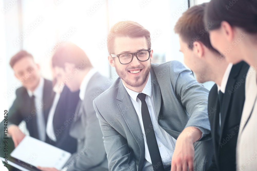 Business Team Having Informal Meeting In Office Business Team Having Informal Meeting In Office