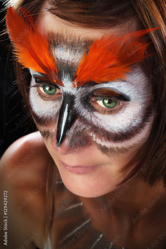 Girl in the mask of an owl, body art Girl in the mask of an owl, body art