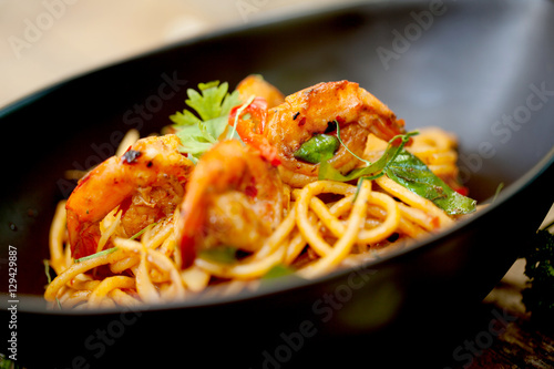 Spaghetti fried with sour prawn soup ,selective focus
