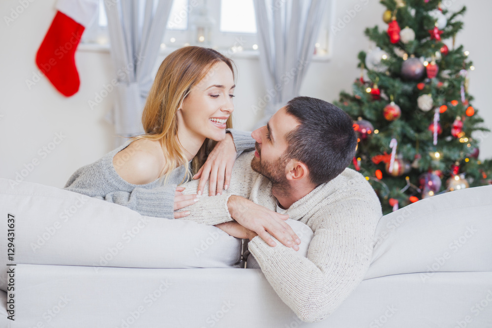 Young couple in love on Christmas night