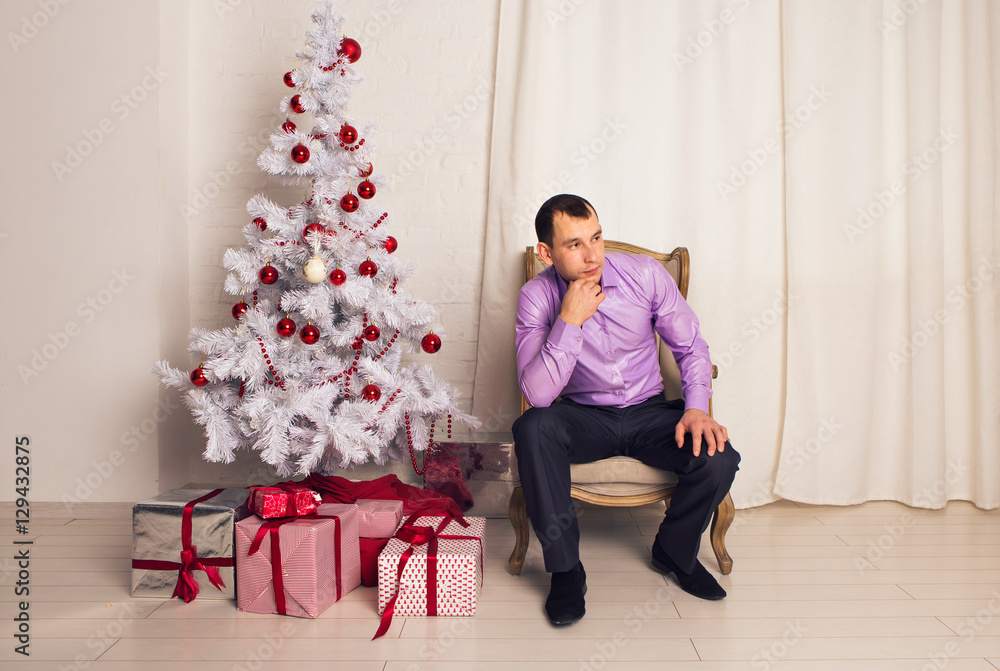 Portrait of office worker with Christmas tree Portrait of office worker with Christmas tree