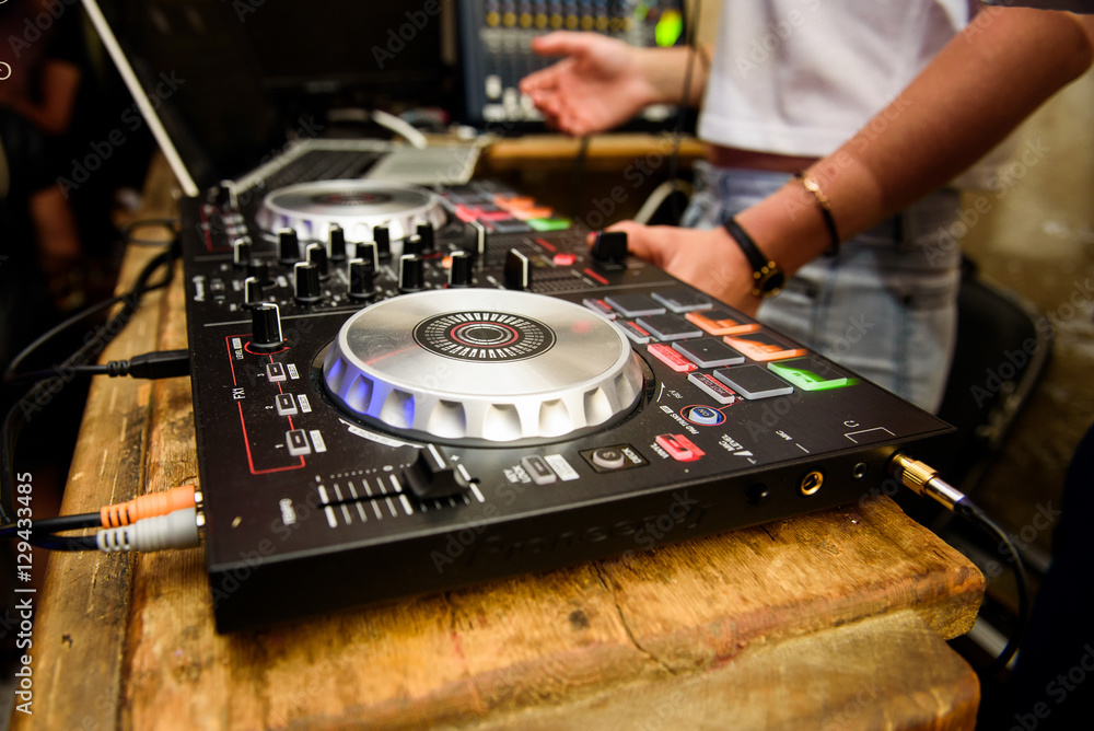 Obraz premium DJ works with panel during party