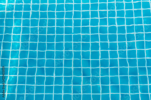 Swimming pool with turquoise blue tiles can be used as background