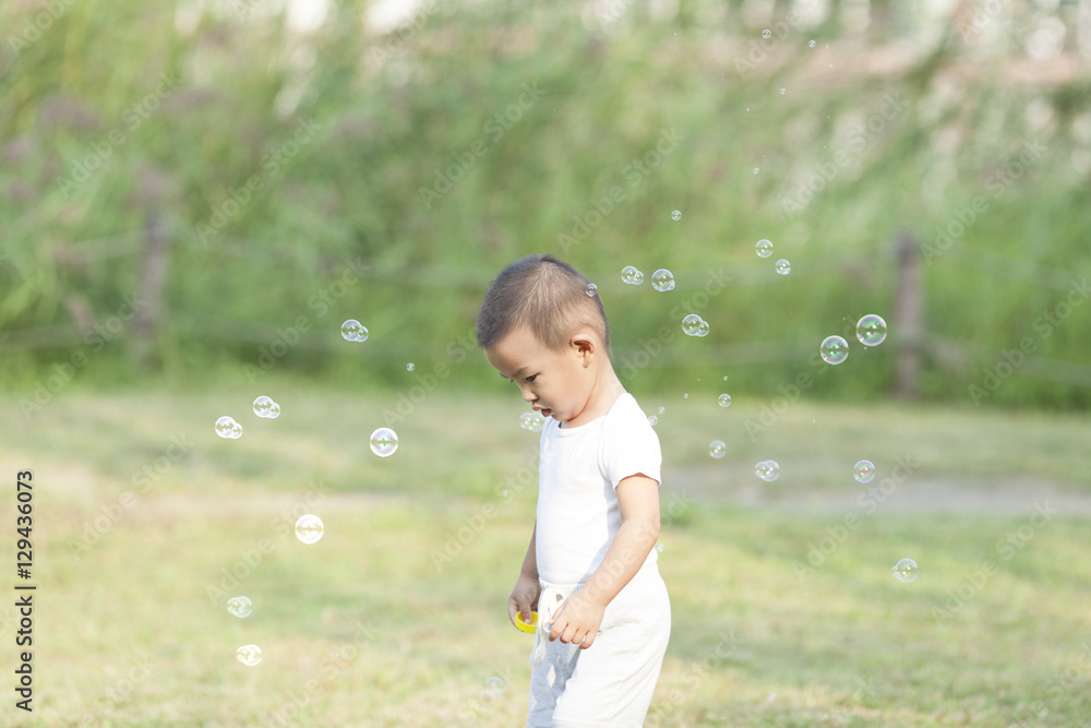 Cute Chinese baby boy playing bubbles Cute Chinese baby boy playing bubbles