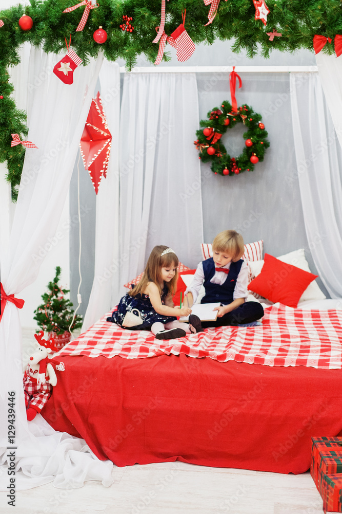 Brother and sister writing a letter to Santa. Brother and sister writing a letter to Santa.