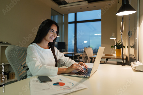 Businesswoman working with laptop in office