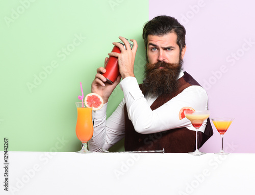 serious handsome bearded barman photo