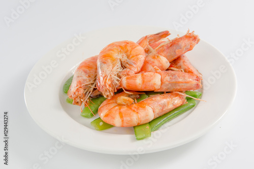Fried shrimp in a plate isolated on white background
