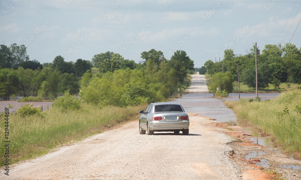 Fototapeta premium Smart driver backing out to turn around from a flood covered road to stay safe