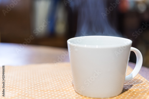 Coffee cup at wooden table