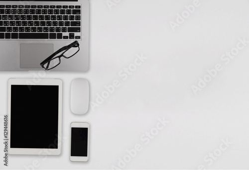 Office desk table with computer, supplies, coffee cOffice desk t photo