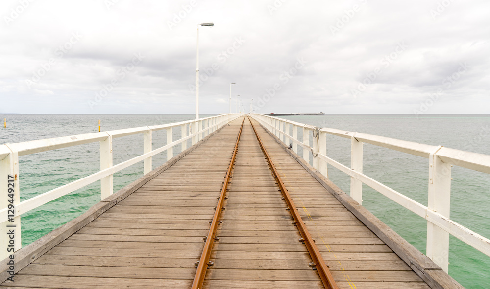 Historic Busselton Jetty in Western Australia, longest timber pier in the Southern Hemisphere, with railway line.