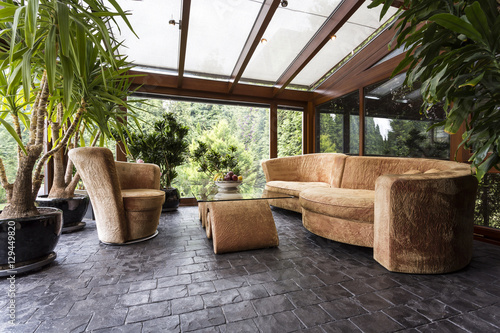 Comfortable lounge set in conservatory photo
