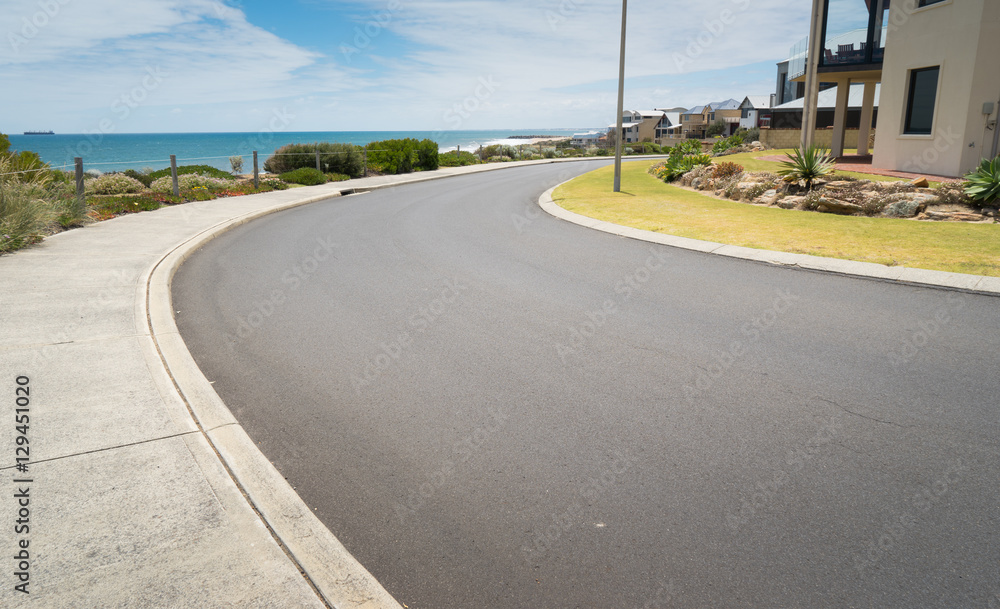 Fototapeta premium Asphalt road at the little coastal town of Myalup near Bunbury Western Australia .