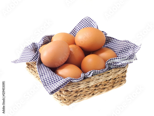 eggs in basket isolated on white background