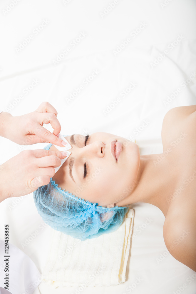 Woman at spa procedure