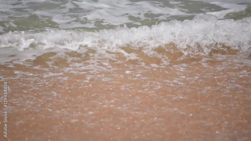 Sea wave closeup with foam of over sandy beach in slow motion. Shallow dof shot. Beautiful seascape view in sunny day. Full HD 1920x1080
Sea wave closeup with foam of over sandy beach in slow motion. Shallow dof shot. Beautiful seascape view in sunny day. Full HD 1920x1080