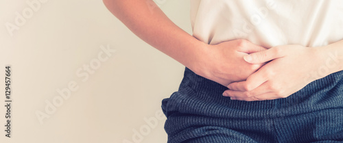 woman stomach ache because of gastritis or menstruation and dige