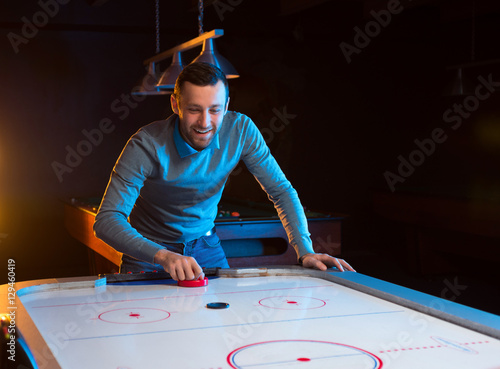 Air hockey game is fun even for adults photo