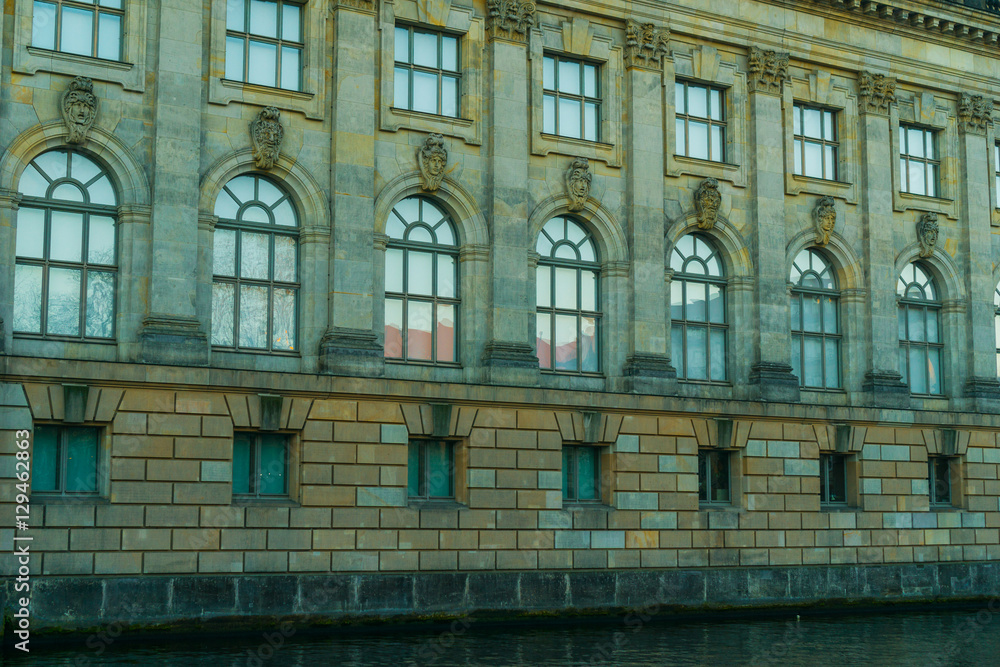 bode museum with stone facade and spree river on the ground