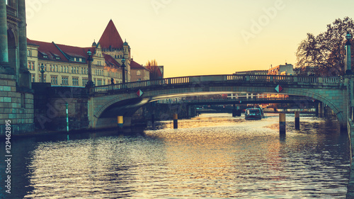 Spree river in the afternoon with a bridge in the middle and the bode museum on the left side
