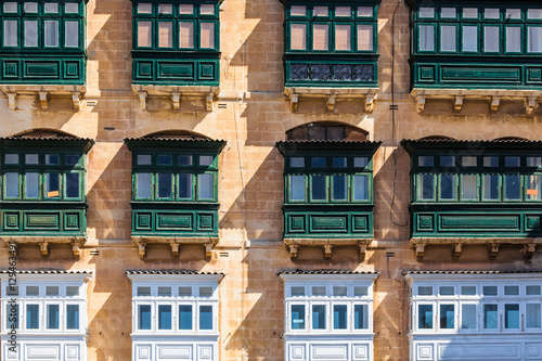 Typical house facade with balconies in Valletta, Malta