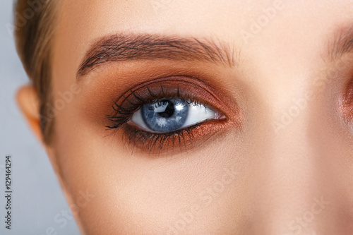 Close-up shot of female eye make-up in smoky eyes style