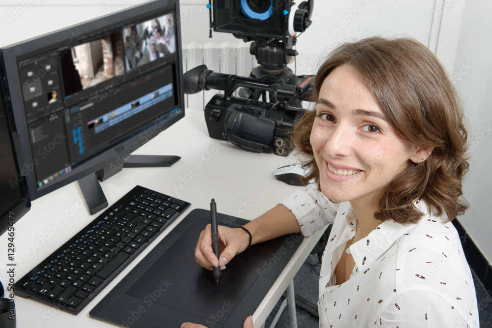 young woman designer using graphics tablet young woman designer using graphics tablet