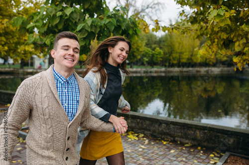 smiling couple in autumn park